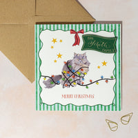 Personalised Christmas card with a cat tangled in a string of lights, surrounded by stars with green striped background and red bow.