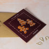 Greeting card with gingerbread men 'To the sweetest couple at Christmas'