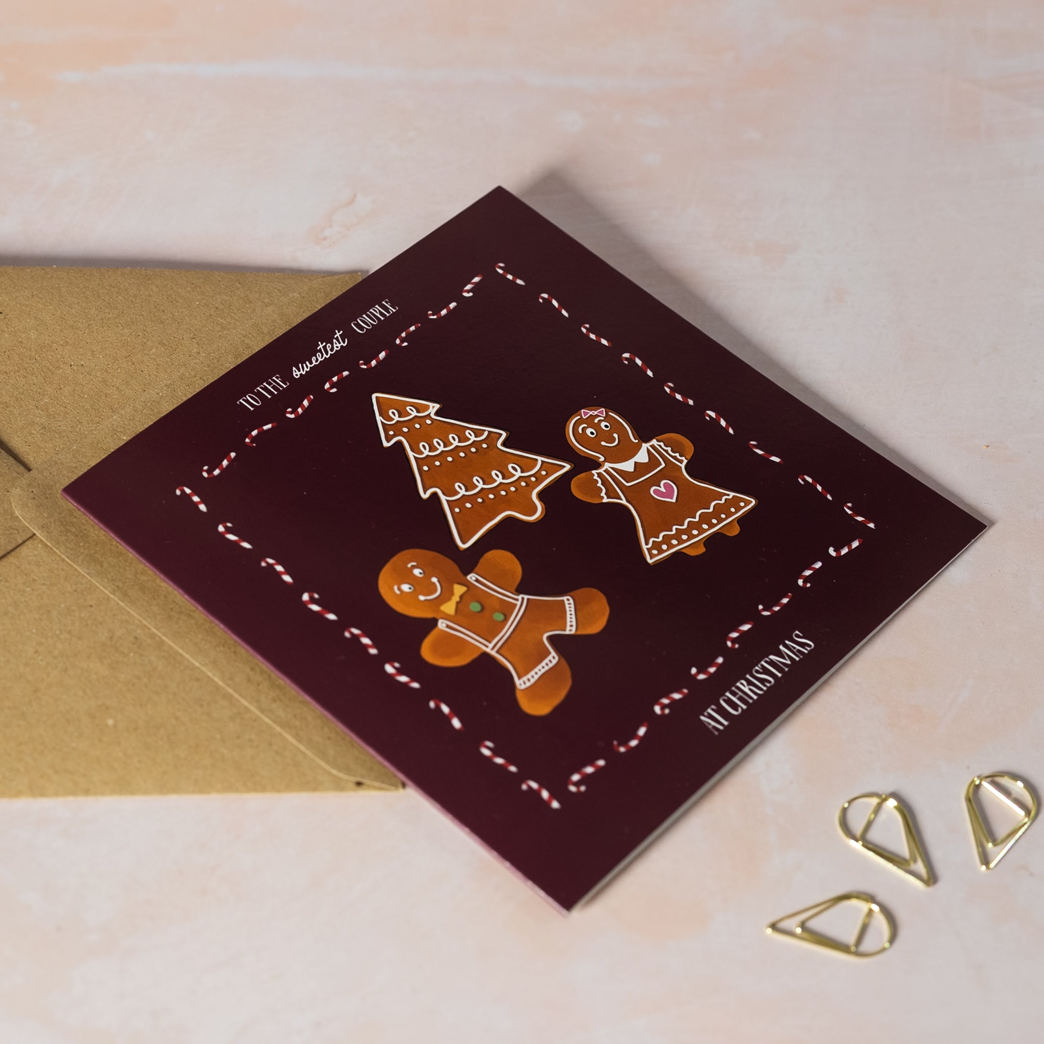 Greeting card with gingerbread men 'To the sweetest couple at Christmas'