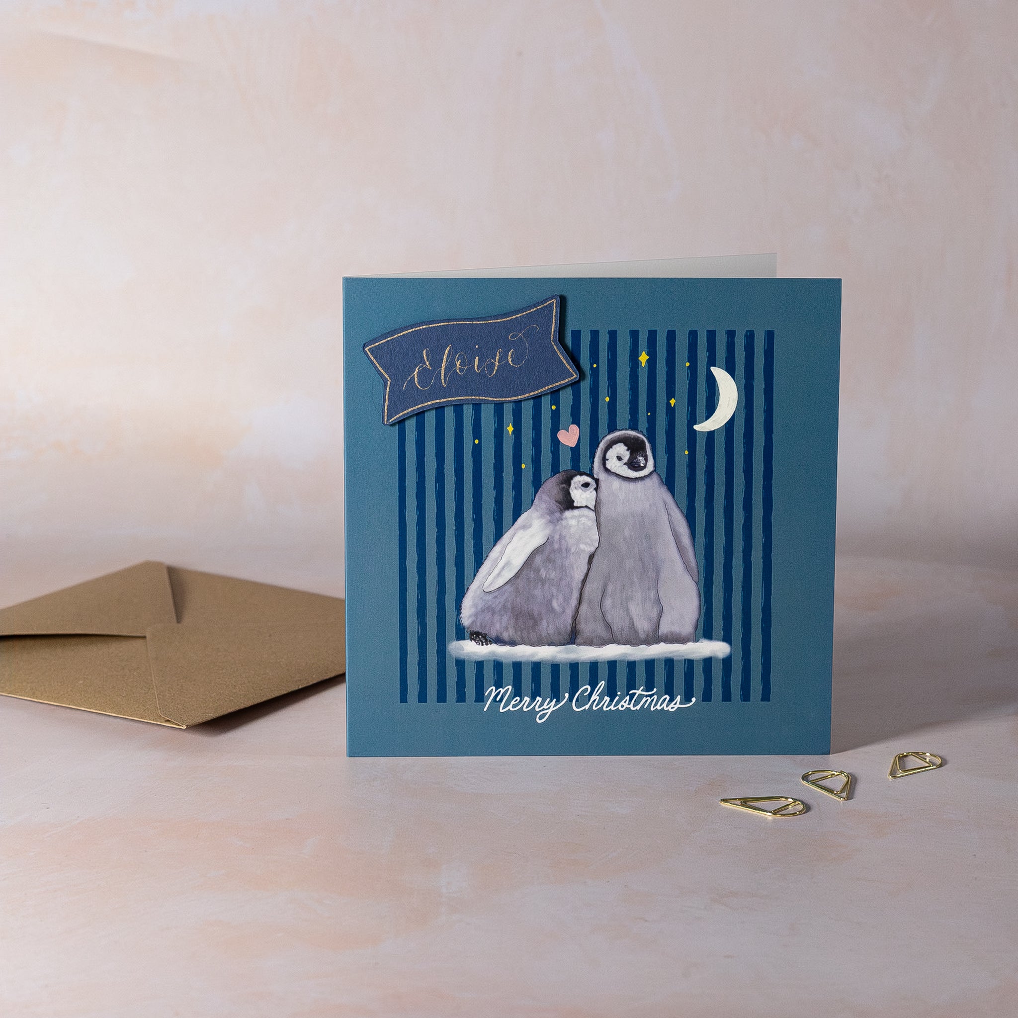 Christmas card with penguin design and personalised calligraphy name