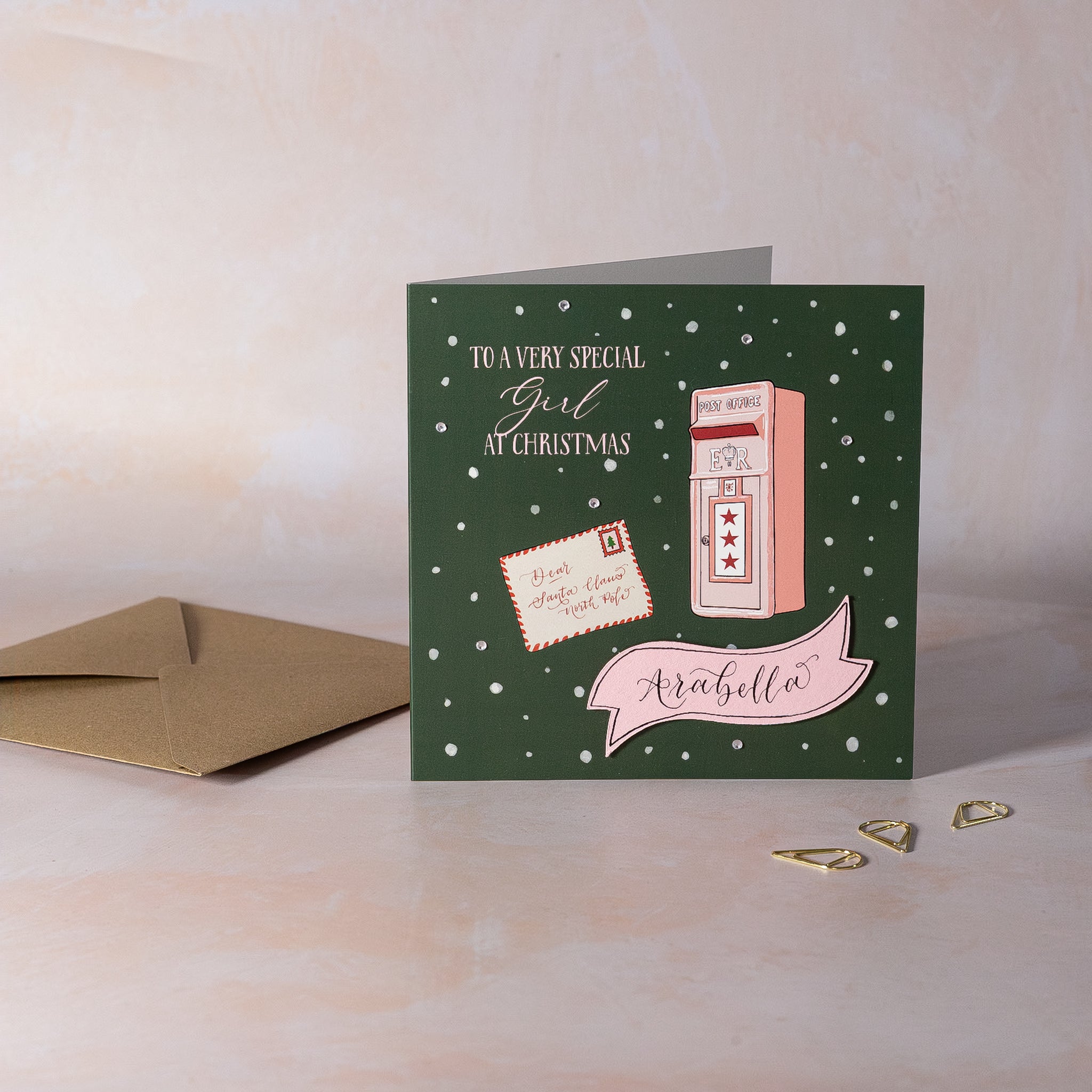 Personalised Christmas card with letter reading Dear Santa Claus and pink mailbox with personalised name.