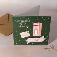 Christmas card with illustration of a mailbox and a letter to Santa with personalised name