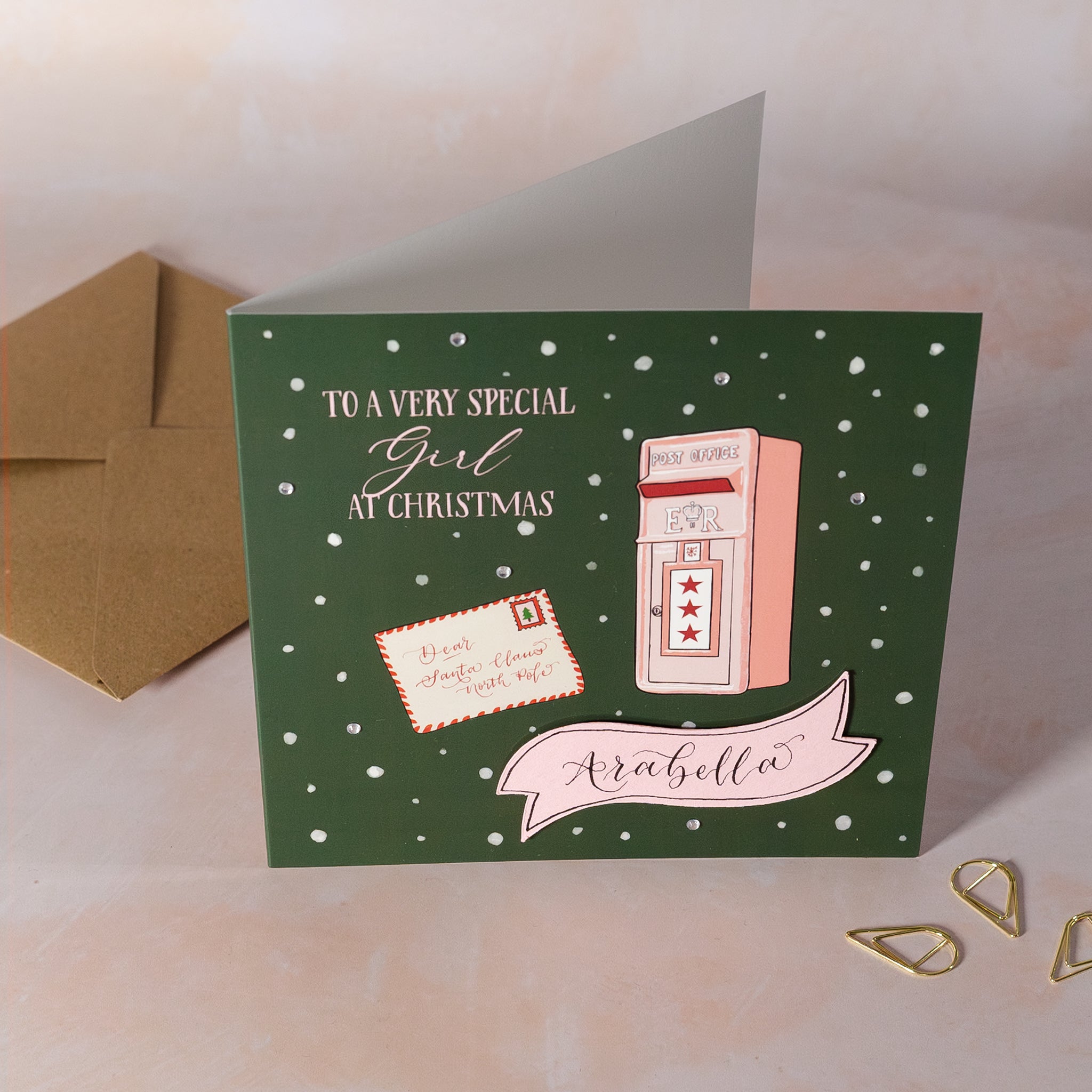 Christmas card with illustration of a mailbox and a letter to Santa with personalised name